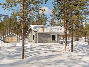 A cabin surrounded by snow-covered ground and trees. - Vacation home Riekko by Interhome (Enontekiö)