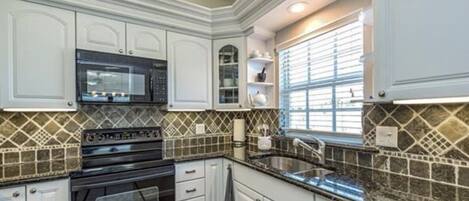 Fridge, microwave, oven, dining tables