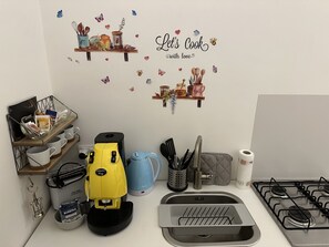 Fridge, stovetop, coffee/tea maker, electric kettle