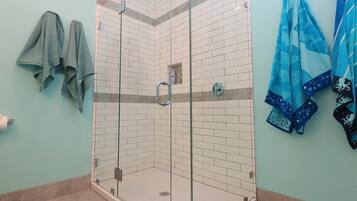 Shower, hair dryer, towels, soap