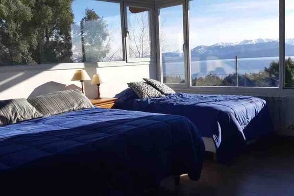 Main room in first floor with queen bed and single bed and stunning views