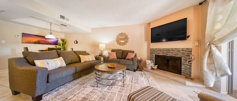 Smart TV, fireplace, books, offices
