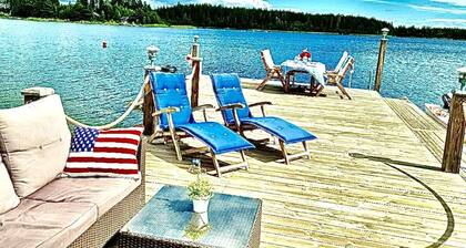 Log house with private beach and own dock incl. boat
