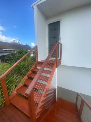 Sturdy staircase leads to an upper floor in this contemporary building.