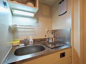 Fridge, microwave, stovetop, cookware/dishes/utensils