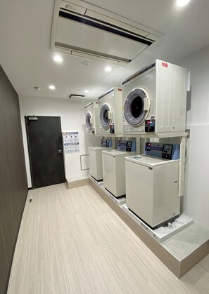 Convenient laundry facilities with modern washing machines and digital controls.