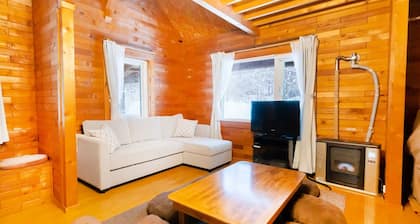 Log Cottage in a Hideaway Forest with BBQ deck big screen projector ready / Isoya-gun Hokkaidō