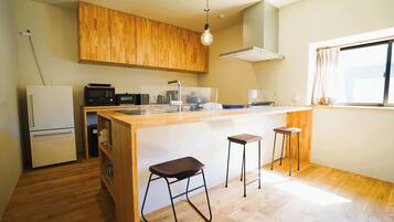 Fridge, microwave, stovetop, cookware/dishes/utensils