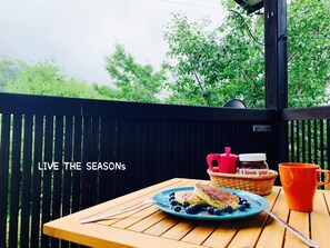 Enjoy a meal al fresco with a view of lush greenery.