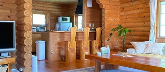 A fullfledged resort log house facing a mountain / Takashima Shiga