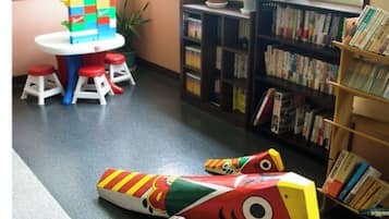 Children can play and learn in this library area with a table for building and books to explore.