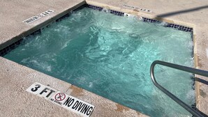 A hot tub with a 'No Diving' sign and a '3 FT' depth marker.