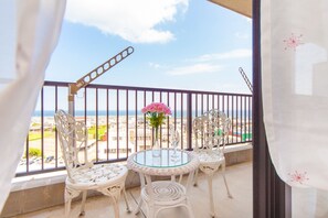 Enjoy breathtaking views of the sea and surrounding residential area from this balcony.