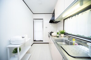 Fridge, microwave, stovetop, cookware/dishes/utensils