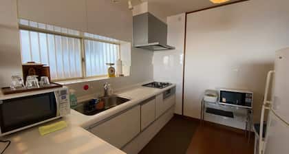 A house with a night view and a healing wood stove - HH / Kitakyushu Fukuoka