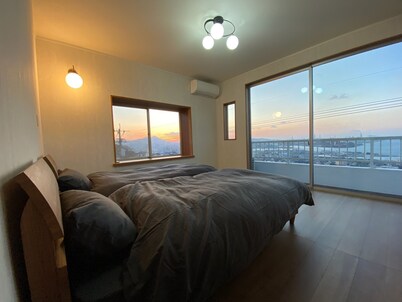 A house with a night view and a healing wood stove - HH / Kitakyushu Fukuoka