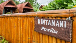A wooden sign with the text "KINTAMANI Paradise" attached to a bamboo fence. - KINTAMANI Paradise (Kintamani)