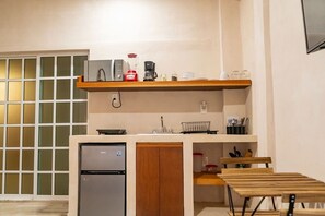 Fridge, stovetop, coffee/tea maker, cookware/dishes/utensils