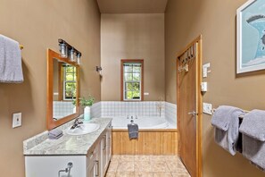 Jetted tub, hair dryer, towels, soap