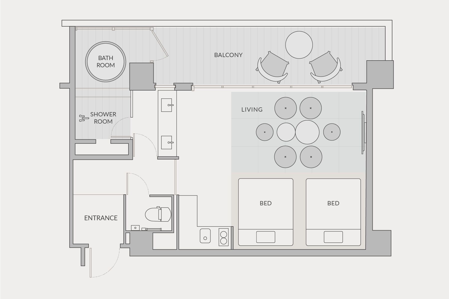 A floor plan of a hotel room with a balcony, a shower room, a living area with multiple seating options, and two beds.