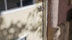 A door with a window, a doorbell, and a small vent. - close to downtown, to Strip Las Vegas , Arts District, (Las Vegas)