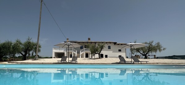 Outdoor pool, pool umbrellas, pool loungers