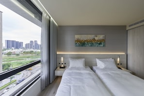 Chambre Élite avec lits jumeaux, plusieurs lits, non-fumeurs | Couette en duvet d'oie, articles gratuits dans le mini-bar