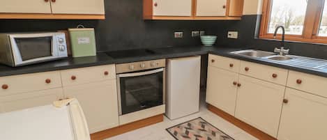 Fridge, electric kettle, toaster, cookware/dishes/utensils