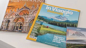 Three travel magazines with covers featuring architectural and natural landscapes.
