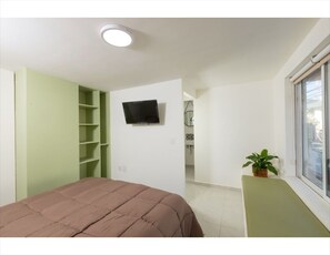 Habitación, 2 habitaciones, para fumadores, vista a la ciudad | 2 habitaciones