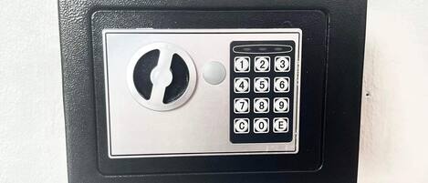 A wall-mounted electronic keypad lock.