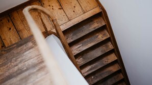 A wooden staircase with a metal handrail. - Gorgeous Duplex Apartment in old City Centre (Antwerp)
