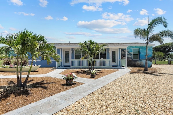 Charming Exterior: Discover vibrant landscapes and a welcoming entrance to your beach getaway!