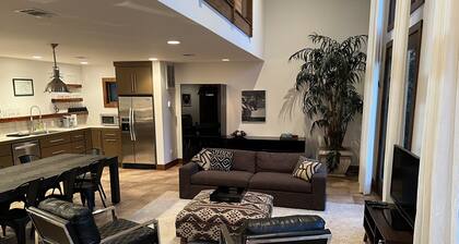 Stunning and private mid-century modern inspired cottage nestled in the woods.