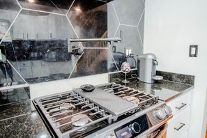 Fridge, coffee/tea maker, cookware/dishes/utensils