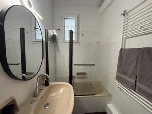 Hair dryer, slippers, towels, soap