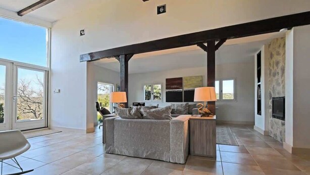 A modern living room with a sofa set, two lamps, and a fireplace. - Hill-top haven with private pool & endless views (Belvezet)