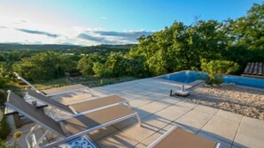 A patio with outdoor seating and a pool. - Hill-top haven with private pool & endless views (Belvezet)