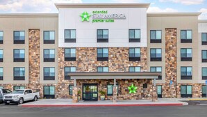 A multi-story hotel with a sign for 'extended STAY AMERICA premier suites'. - Extended Stay America Premier Suites - San Diego - San Marcos (San Marcos)