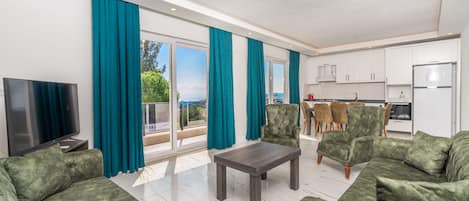 Luxury Apartment | Living area | 50-inch LED TV with digital channels, TV