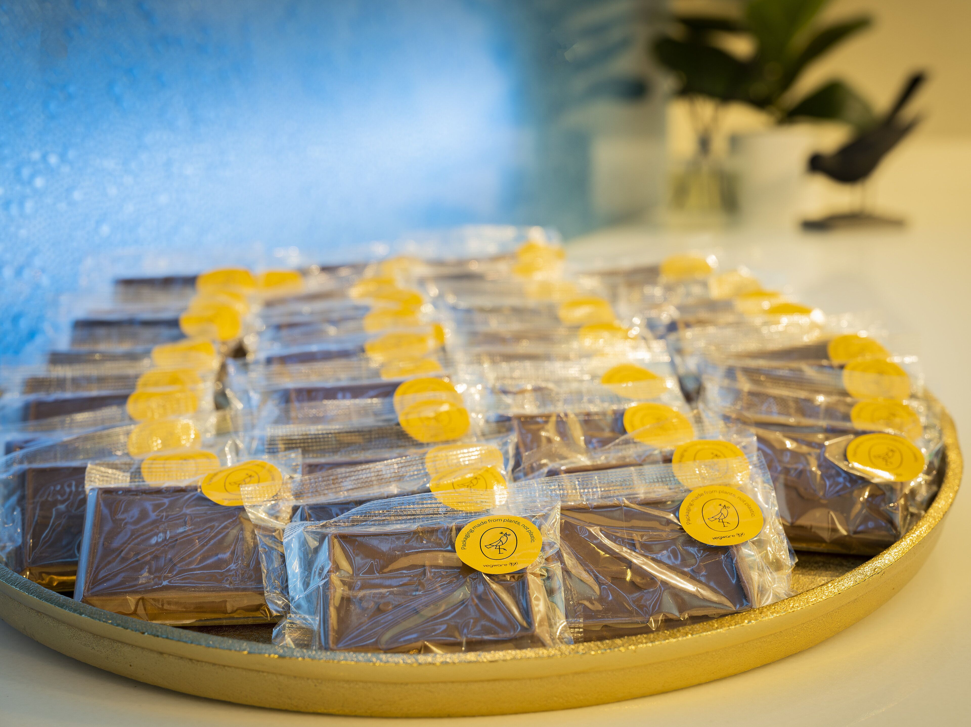 A tray of packaged chocolates arranged in rows.