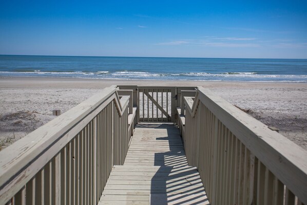 A wooden boardwalk leading to a beach with a clear view of the ocean. - PRIVATE WALKWAY TO THE BEACH, ONE OF THE FEW ON THE GRAND STRAND! (Surfside Beach)