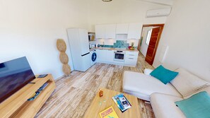 Appartement Deluxe, 1 très grand lit et 1 canapé-lit, non-fumeurs | Coin séjour