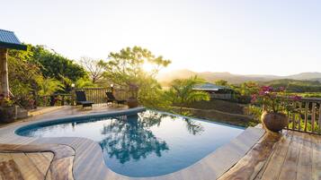 Outdoor pool, open 7:00 AM to 10:00 PM, pool umbrellas, sun loungers