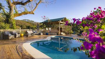 Outdoor pool, open 7:00 AM to 10:00 PM, pool umbrellas, sun loungers