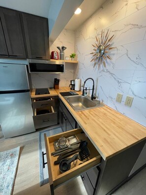 Fridge, microwave, stovetop, coffee/tea maker