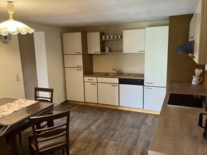 Dishwasher, high chair, dining tables