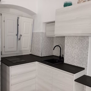 Deluxe Apartment | Private kitchen | Full-sized fridge, dining tables