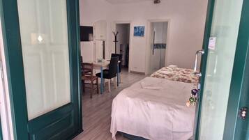 Deluxe Apartment | Living area | 32-inch LED TV with digital channels