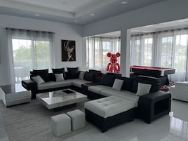 Luxury Villa (Top Floor) | Living area | 70-inch LED TV with cable channels, Netflix, streaming services